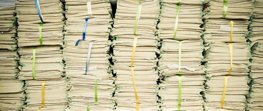 Stacks of paperwork from a keep all policy