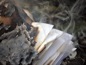 Stack of burnt paper and ash