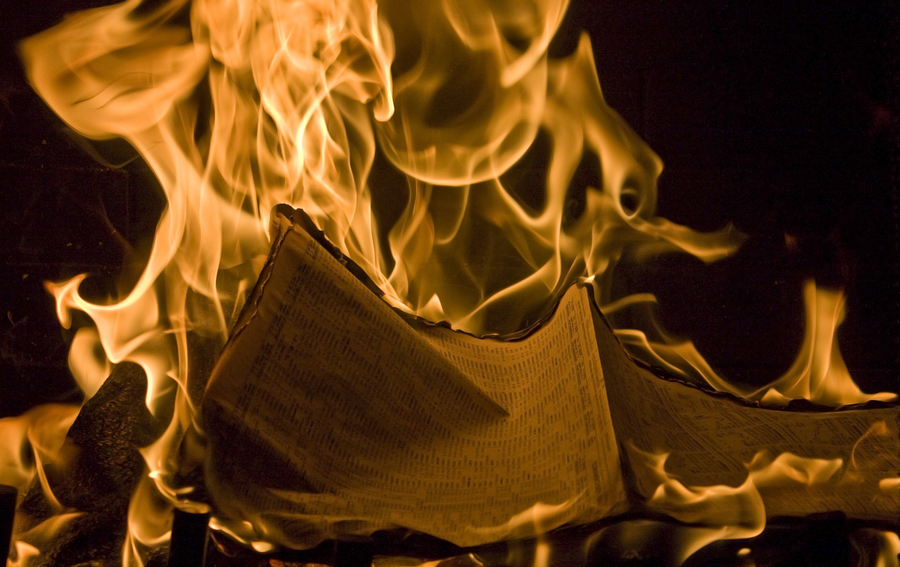 Flames Of Fire Burning Financial Newspaper