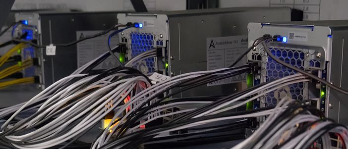 MOSCOW, Russia - September 25, 2019: A working server. Internet wires and flashing lights on the server.