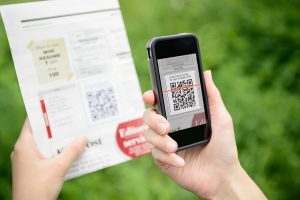 bigstock-Scanning-Advertising-With-Qr-C-33125438