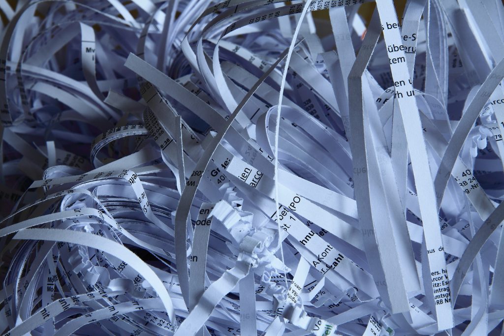 Secure shredded paper in the paper bin