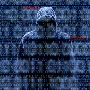Silhouette Of A Hacker Isloated On Black