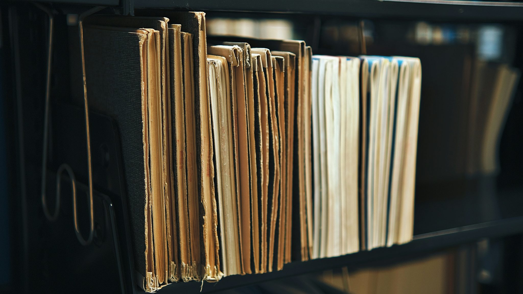 File folders on a shelf, ready for shredding