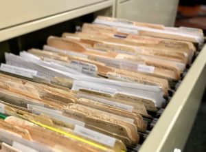 paper files in a filing cabinet